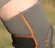 Наколінник MadMax MFA-297 Knee Support with Patella Stabilizer Dark Grey/Orange XL купити