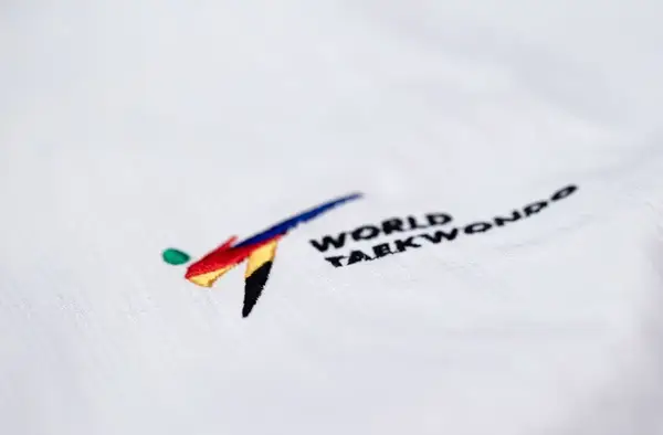 Добок для тхеквондо ADIDAS POOMSAE для дівчаток | біло-червоний 150 | adiTPYF02 купити недорого в Україні, фото 6